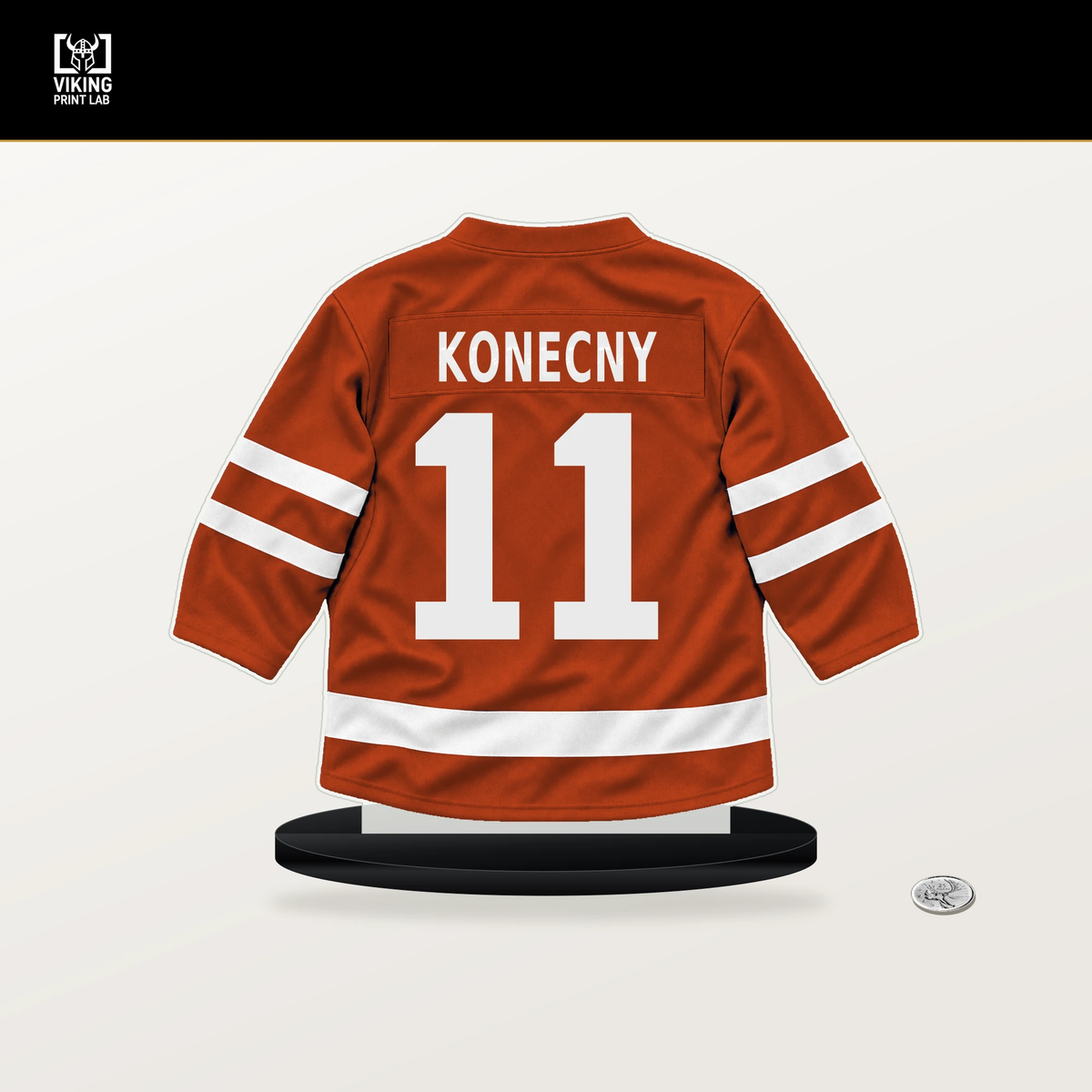 Travis Konecny number 11 Philadelphia Flyers jersey stand with included black base.