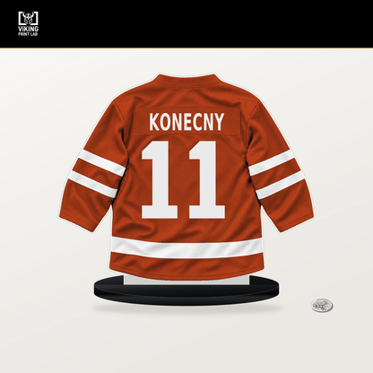 Travis Konecny number 11 Philadelphia Flyers jersey stand with included black base.