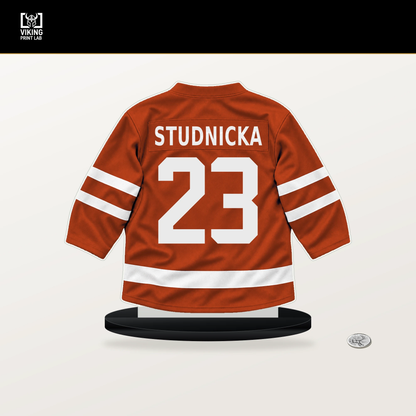 Jack Studnicka number 23 Philadelphia Flyers jersey stand with included black base.