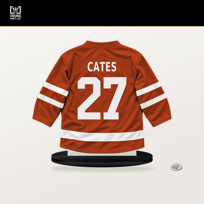 Noah Cates number 27 Philadelphia Flyers jersey stand with included black base.