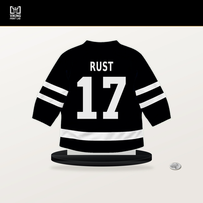 Bryan Rust number 17 Pittsburgh Penguins jersey stand with included black base.