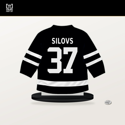 Arturs Silovs number 37 Pittsburgh Penguins jersey stand with included black base.
