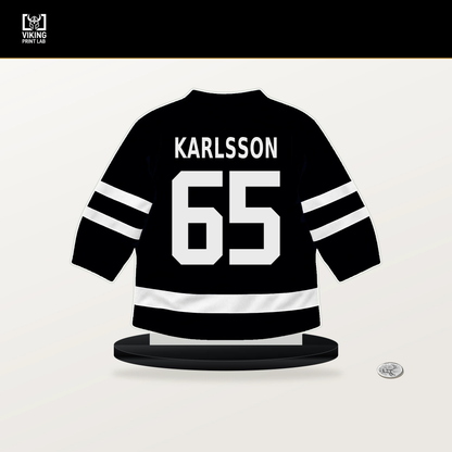 Erik Karlsson number 65 Pittsburgh Penguins jersey stand with included black base.