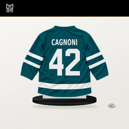 Luca Cagnoni number 42 San Jose Sharks jersey stand with included black base.