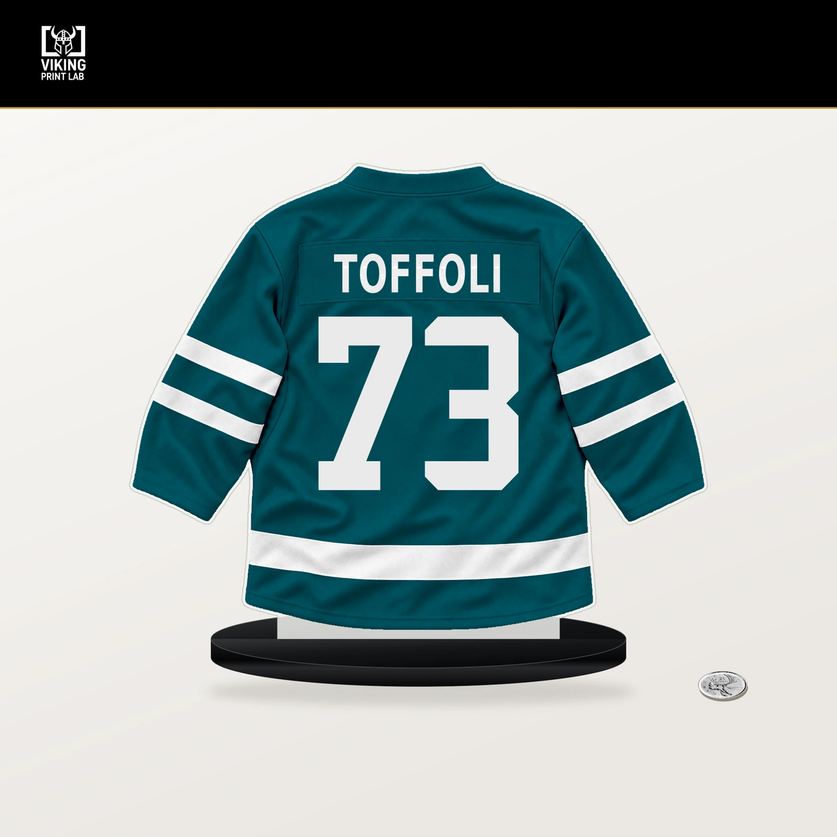 Tyler Toffoli number 73 San Jose Sharks jersey stand with included black base.