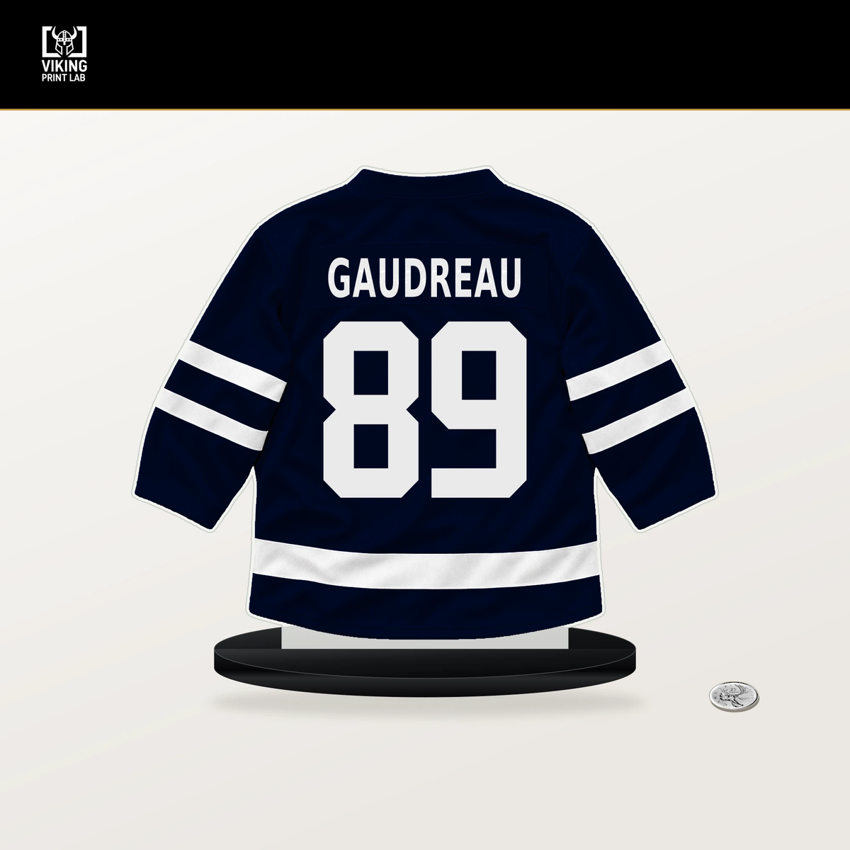 Frederick Gaudreau number 89 Seattle Kraken jersey stand with included black base.
