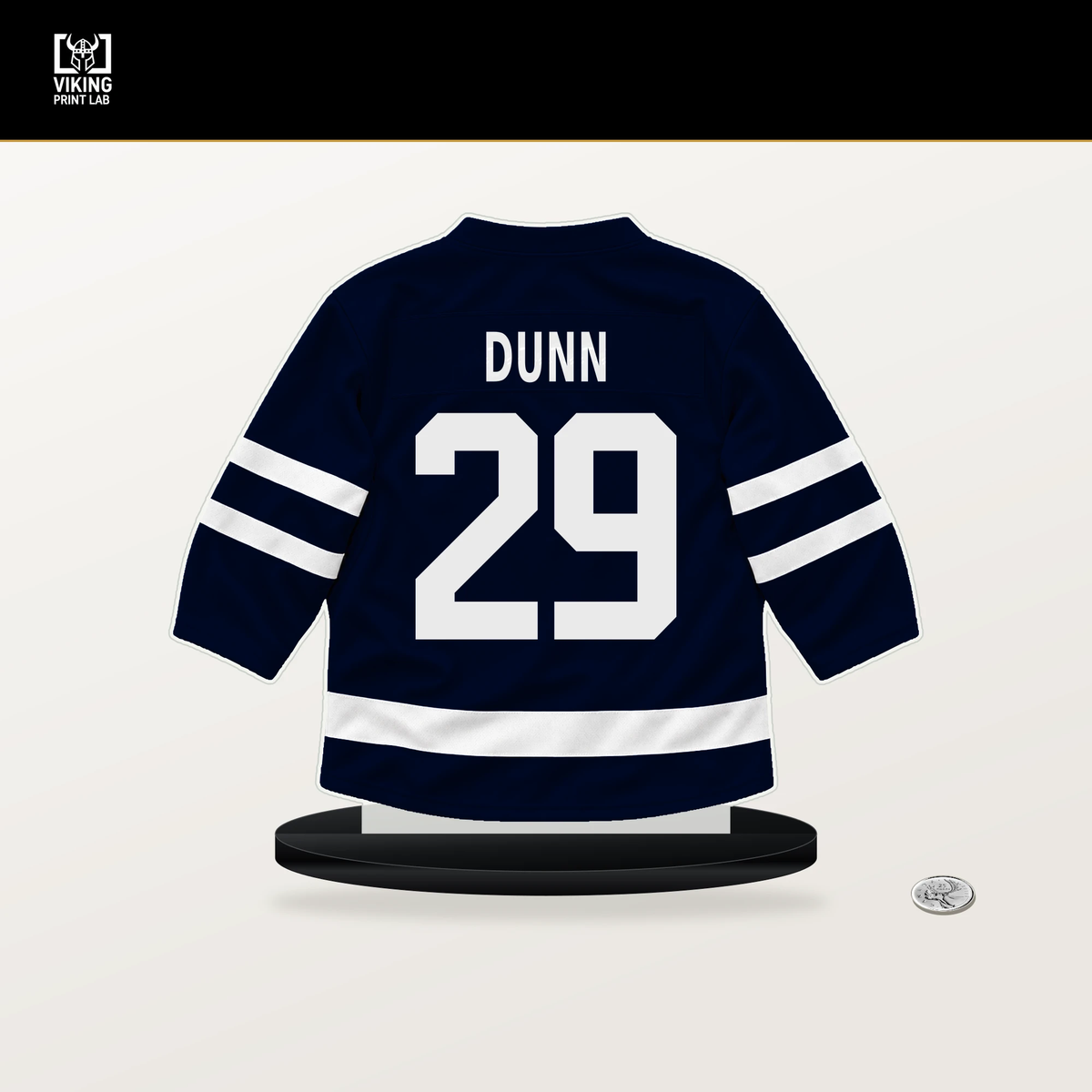 Vince Dunn number 29 Seattle Kraken jersey stand with included black base.