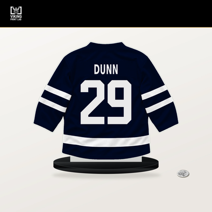 Vince Dunn number 29 Seattle Kraken jersey stand with included black base.