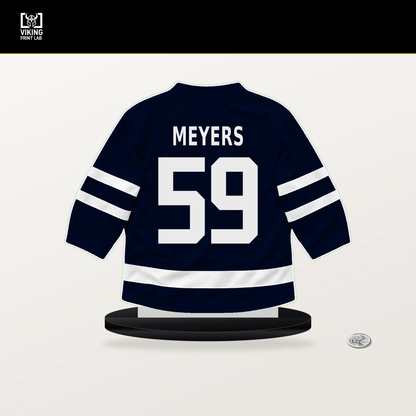 Ben Meyers number 59 Seattle Kraken jersey stand with included black base.