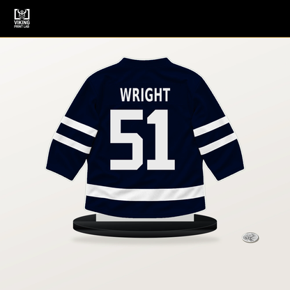 Shane Wright number 51 Seattle Kraken jersey stand with included black base.
