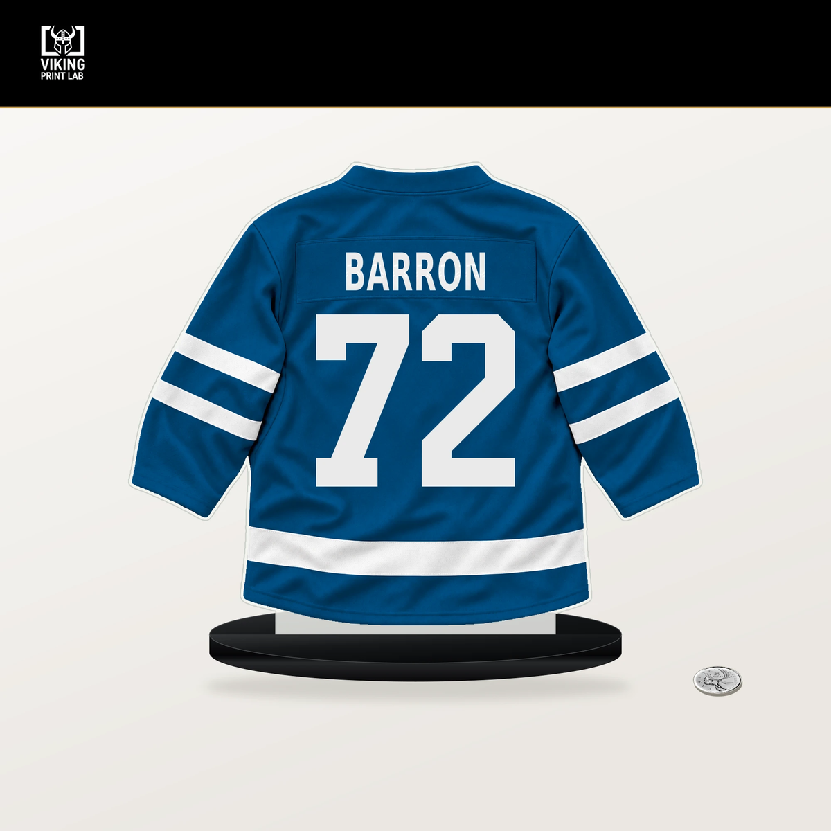 Justin Barron number 72 St. Louis Blues jersey stand with included black base.
