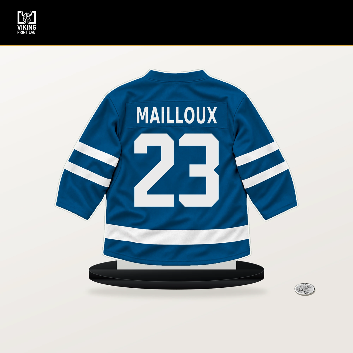 Logan Mailloux number 23 St. Louis Blues jersey stand with included black base.