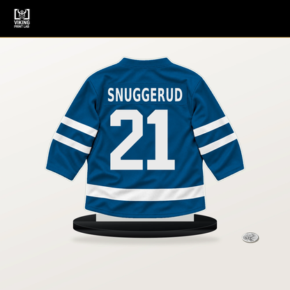 Jimmy Snuggerud number 21 St. Louis Blues jersey stand with included black base.