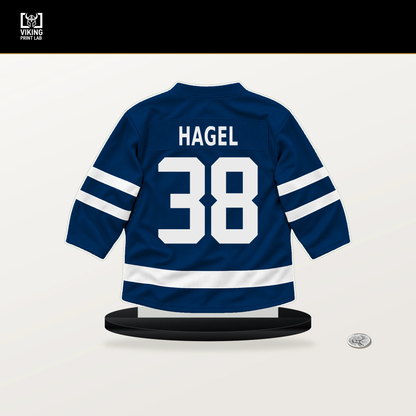 Brandon Hagel number 38 Tampa Bay Lightning jersey stand with included black base.
