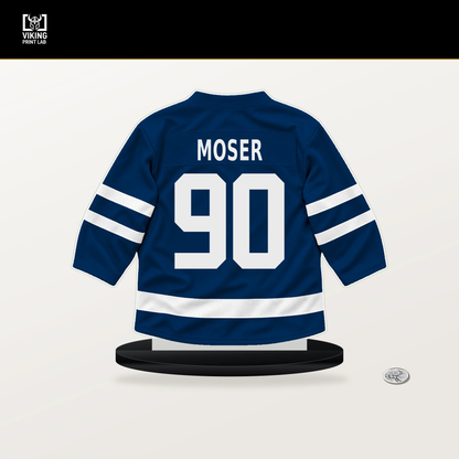 J.J. Moser number 90 Tampa Bay Lightning jersey stand with included black base.