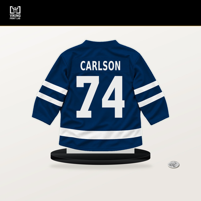 John Carlson number 74 Tampa Bay Lightning jersey stand with included black base.