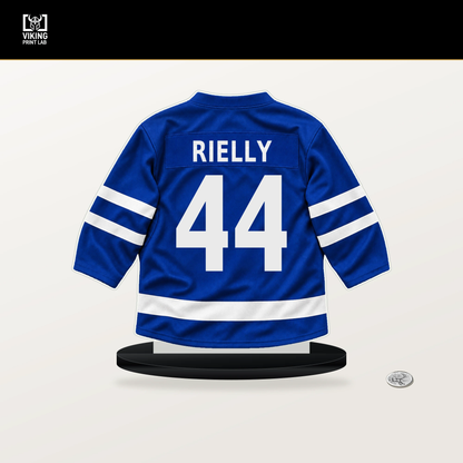 Morgan Rielly number 44 Toronto Maple Leafs jersey stand with included black base.