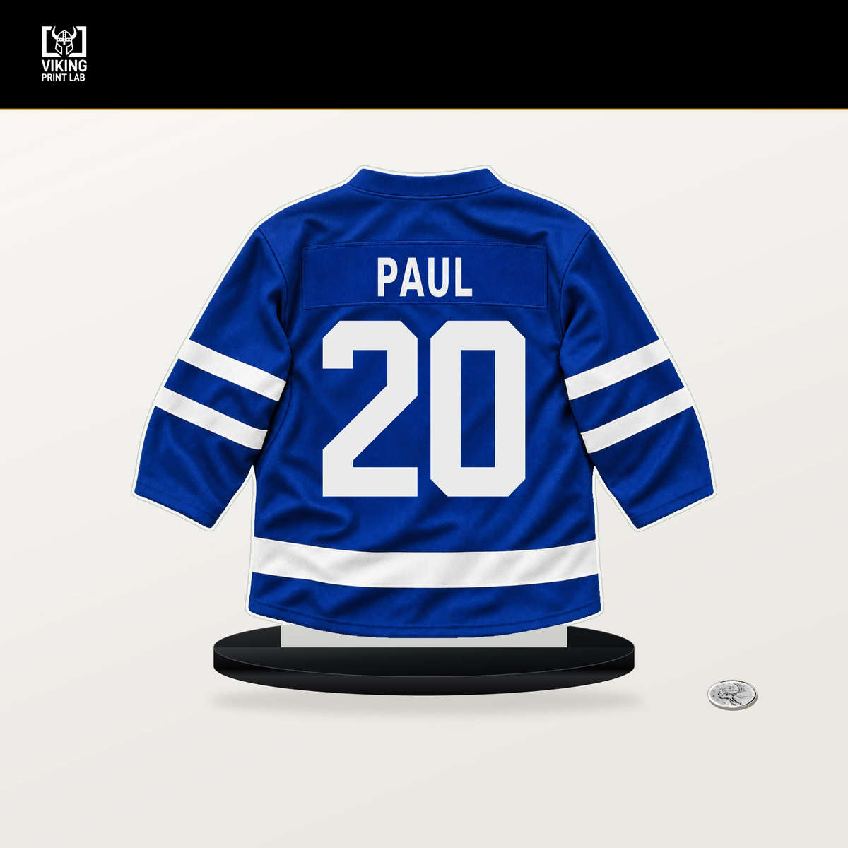Nick Paul number 20 Toronto Maple Leafs jersey stand with included black base.