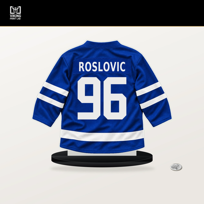 Jack Roslovic number 96 Toronto Maple Leafs jersey stand with included black base.