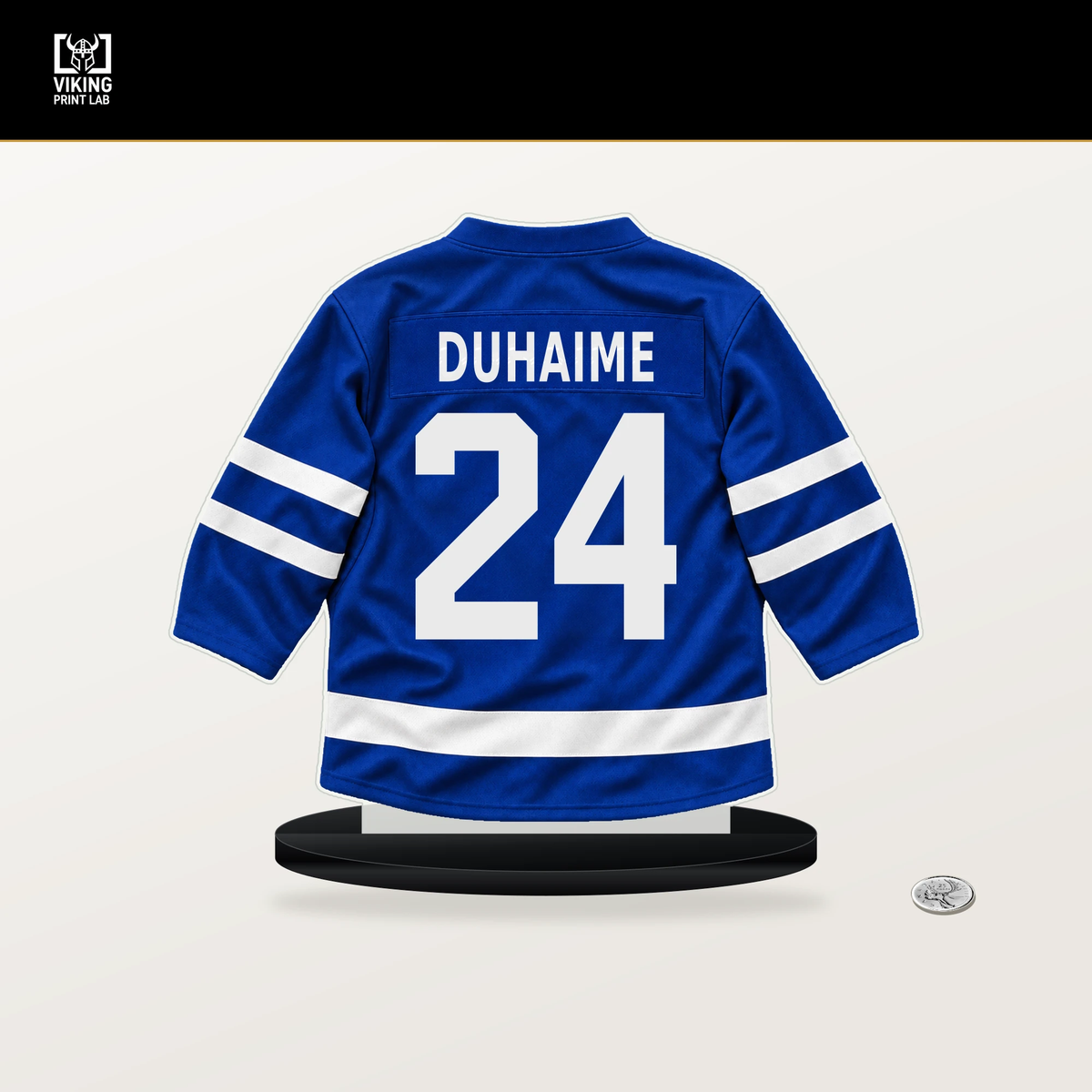 Brandon Duhaime number 24 Toronto Maple Leafs jersey stand with included black base.