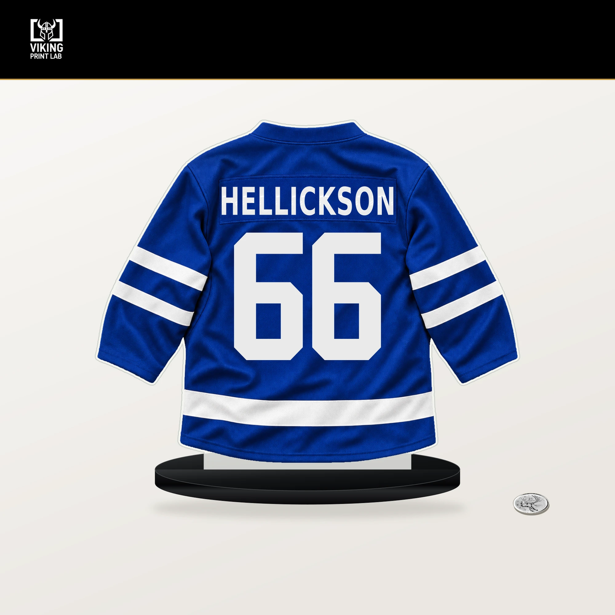 Matt Hellickson number 66 Toronto Maple Leafs jersey stand with included black base.