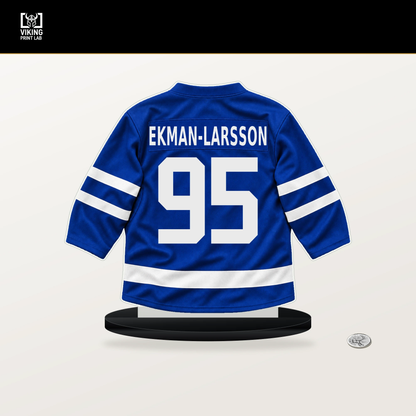 Oliver Ekman-Larsson number 95 Toronto Maple Leafs jersey stand with included black base.