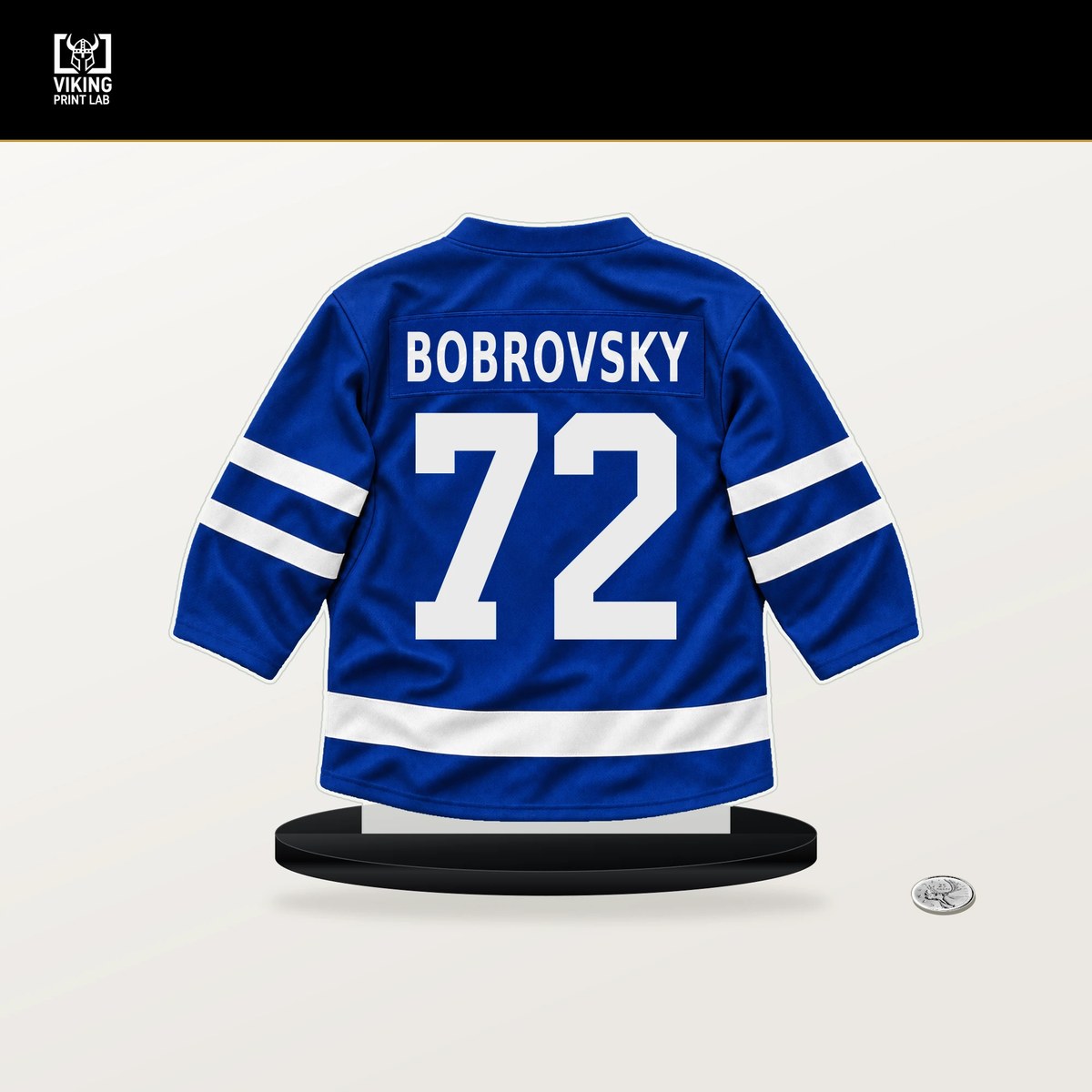 Sergei Bobrovsky number 72 Toronto Maple Leafs jersey stand with included black base.
