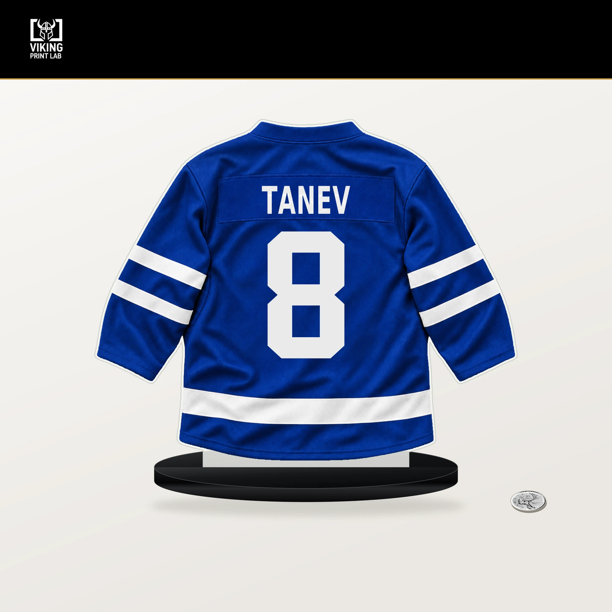 Chris Tanev number 8 Toronto Maple Leafs jersey stand with included black base.