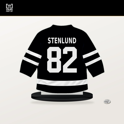 Kevin Stenlund number 82 Utah Mammoth jersey stand with included black base.