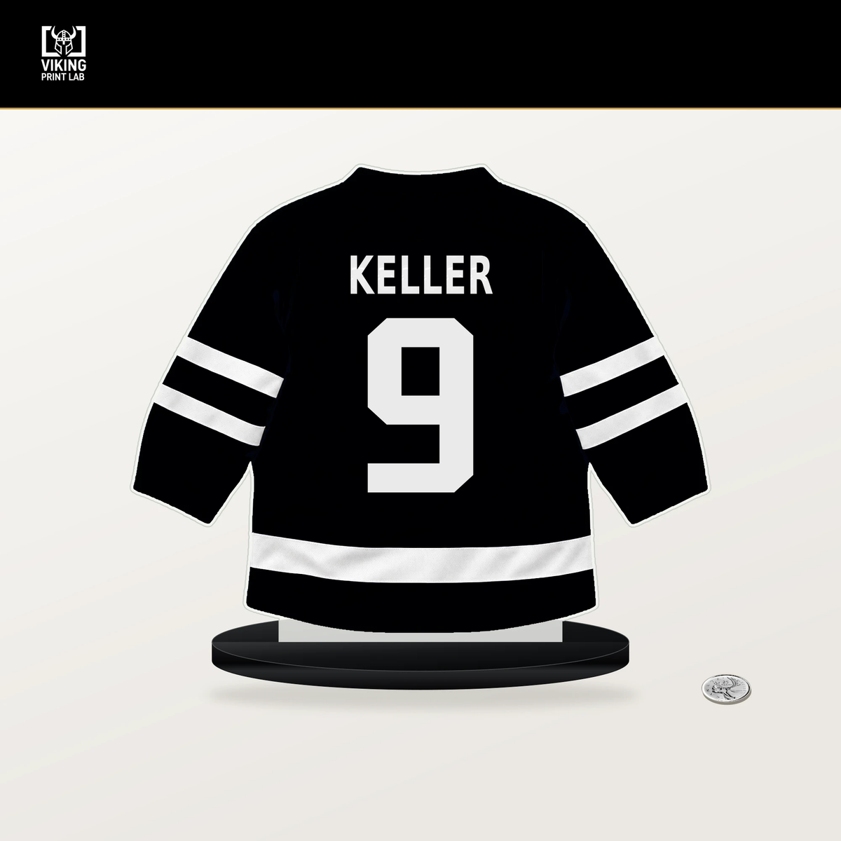 Clayton Keller number 9 Utah Mammoth jersey stand with included black base.