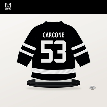 Michael Carcone number 53 Utah Mammoth jersey stand with included black base.