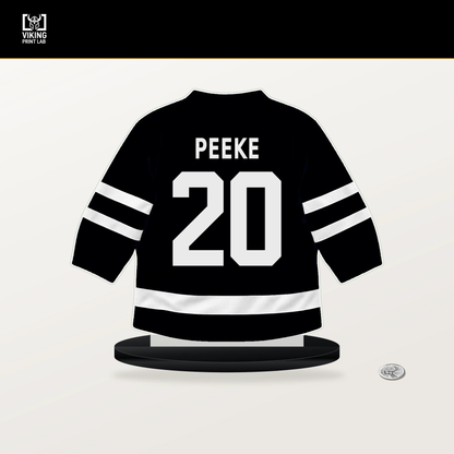 Andrew Peeke number 20 Utah Mammoth jersey stand with included black base.