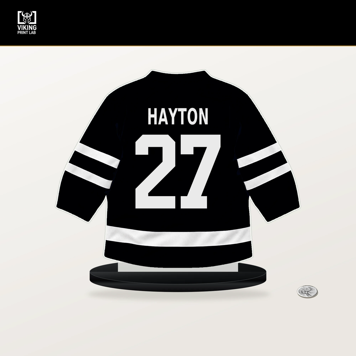 Barrett Hayton number 27 Utah Mammoth jersey stand with included black base.