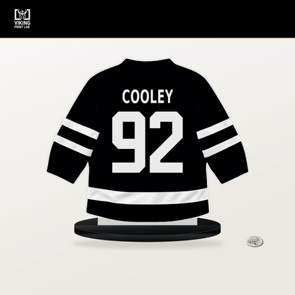 Logan Cooley number 92 Utah Mammoth jersey stand with included black base.
