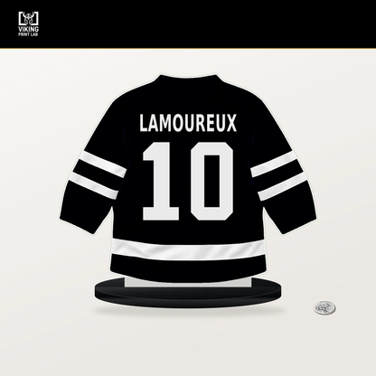 Maveric Lamoureux number 10 Utah Mammoth jersey stand with included black base.
