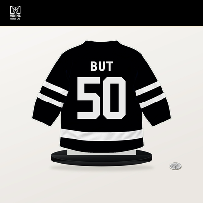 Daniil But number 50 Utah Mammoth jersey stand with included black base.