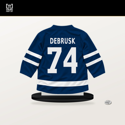 Jake DeBrusk number 74 Vancouver Canucks jersey stand with included black base.