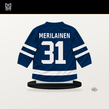 Leevi Merilainen number 31 Vancouver Canucks jersey stand with included black base.