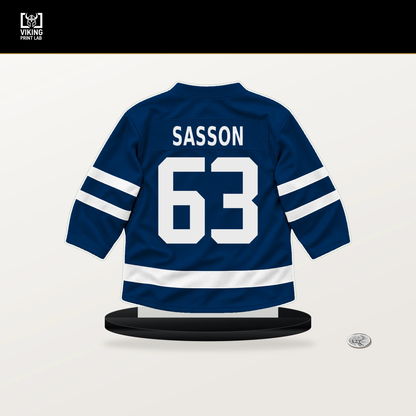 Max Sasson number 63 Vancouver Canucks jersey stand with included black base.