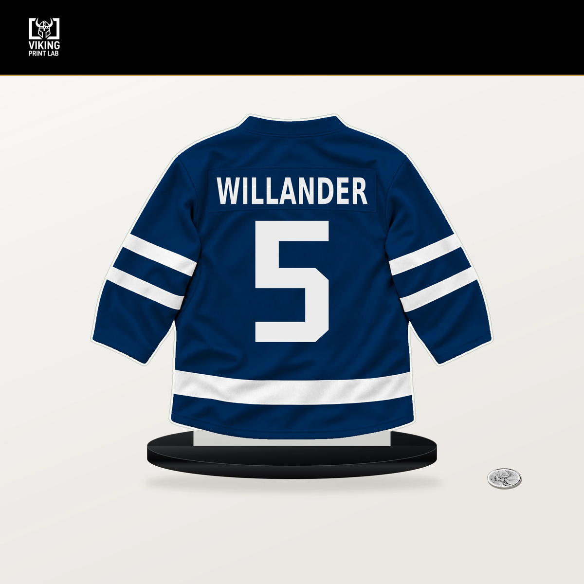 Tom Willander number 5 Vancouver Canucks jersey stand with included black base.