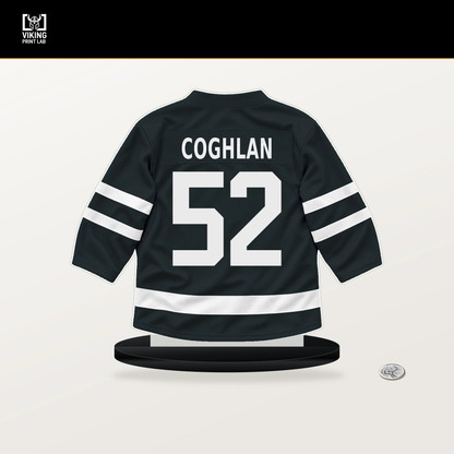 Dylan Coghlan number 52 Vegas Golden Knights jersey stand with included black base.