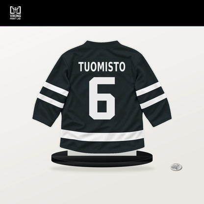 Antti Tuomisto number 6 Vegas Golden Knights jersey stand with included black base.