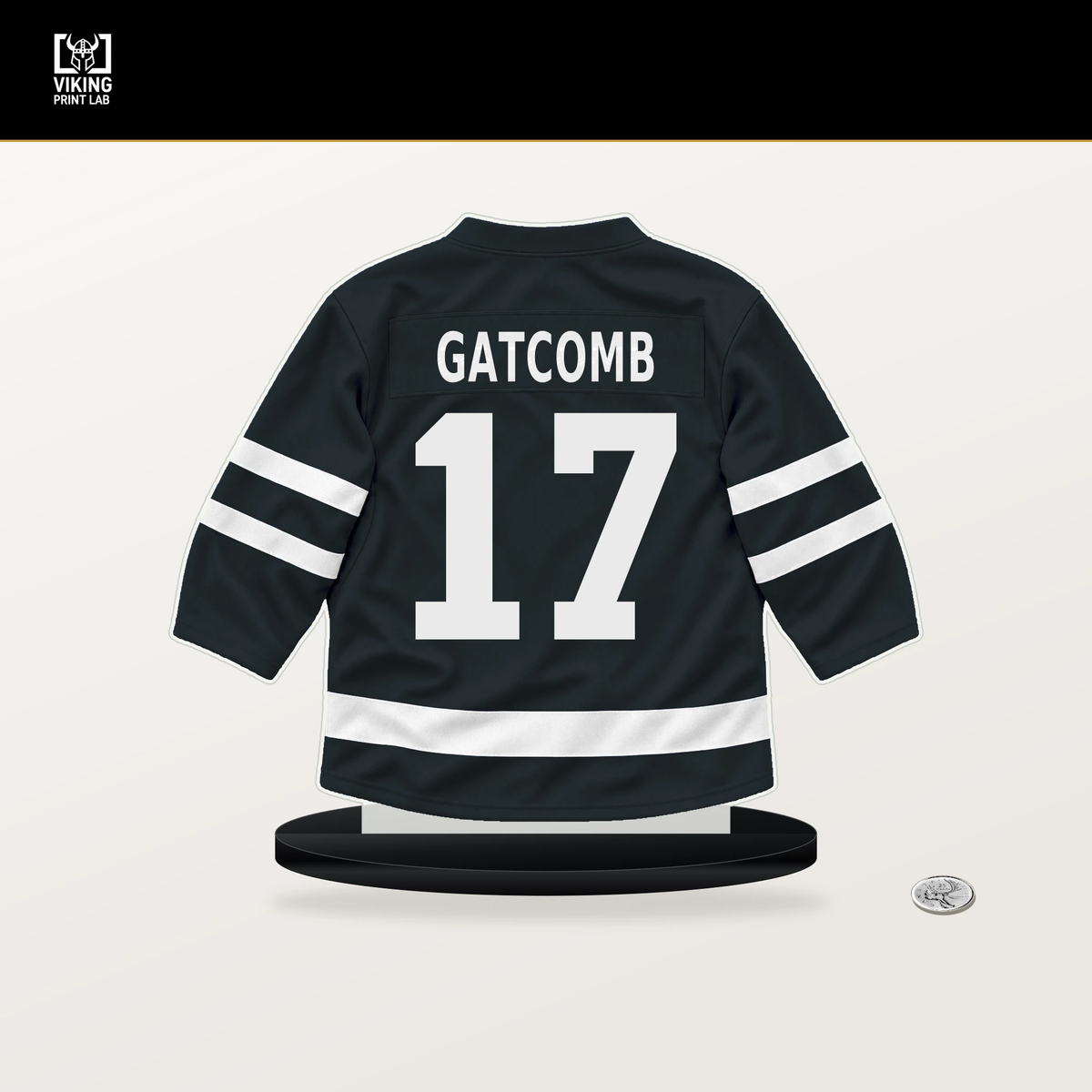 Marc Gatcomb number 17 Vegas Golden Knights jersey stand with included black base.