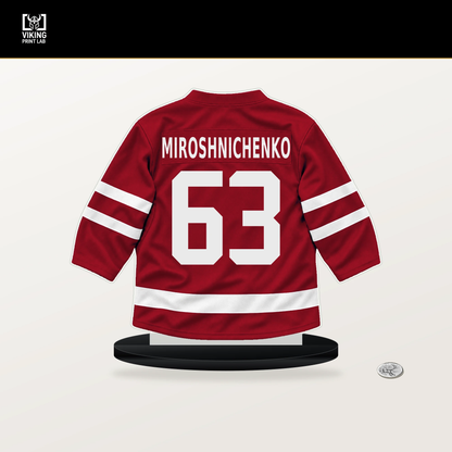 Ivan Miroshnichenko number 63 Washington Capitals jersey stand with included black base.