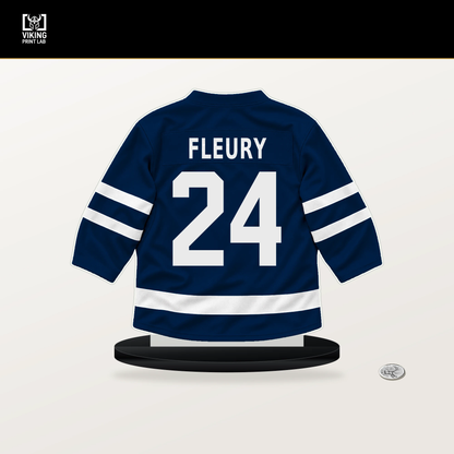 Haydn Fleury number 24 Winnipeg Jets jersey stand with included black base.