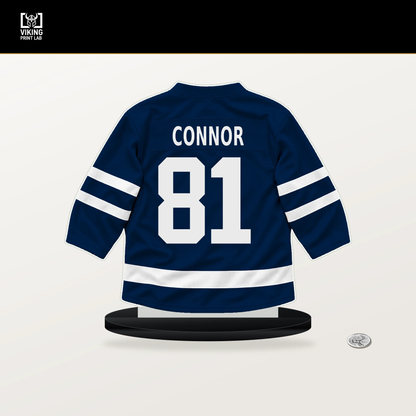 Kyle Connor number 81 Winnipeg Jets jersey stand with included black base.