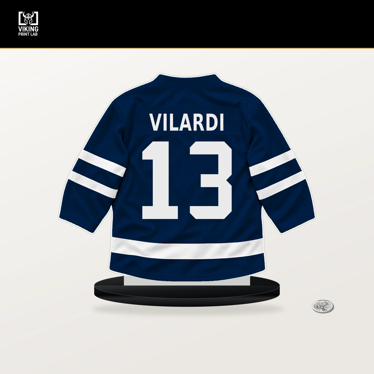 Gabriel Vilardi number 13 Winnipeg Jets jersey stand with included black base.