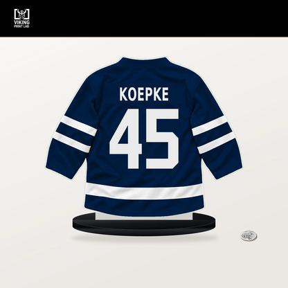 Cole Koepke number 45 Winnipeg Jets jersey stand with included black base.