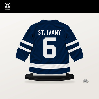 Jack St. Ivany number 6 Winnipeg Jets jersey stand with included black base.