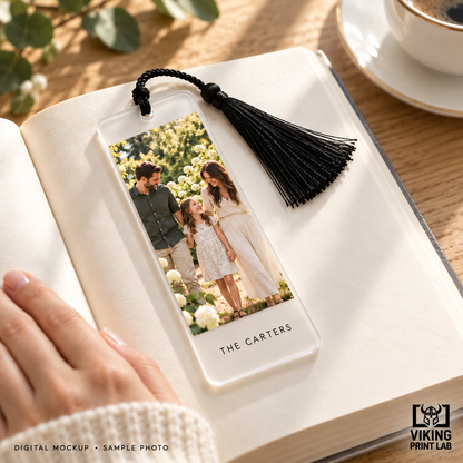 Digital mockup of a personalized frosted acrylic family photo bookmark with a black tassel.